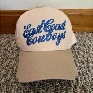 (NEW) ‘East Coast Cowboys’ Women’s Trucker Hat — Beige with Blue Embroidery
